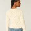Cardigan à œillets Cardigan à œillets