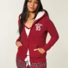 Collection Holiday Vault Sweat à capuche zippé avec logo graphique et doublure en sherpa Collection Holiday Vault Sweat à capuche zippé avec logo graphique et doublure en sherpa
