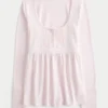 Haut babydoll à manches longues et col Henley Haut babydoll à manches longues et col Henley