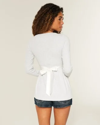 Haut babydoll à manches longues et devant croisé
