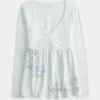 Haut babydoll à manches longues et motif graphique Haut babydoll à manches longues et motif graphique