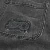 Jean baggy noir délavé avec logo graphique Jean baggy noir délavé avec logo graphique