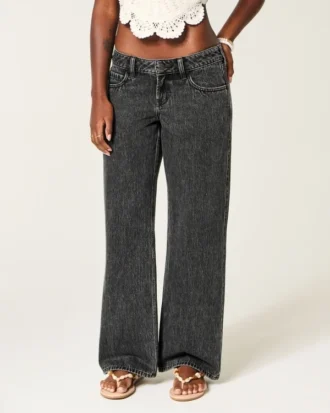 Jean baggy noir délavé à taille ultra basse et boucle dans le dos
