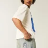 Jean baggy skater délavé clair avec broderie en forme de dés