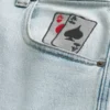 Jean baggy skateur délavé clair avec motif cartes à jouer Jean baggy skateur délavé clair avec motif cartes à jouer