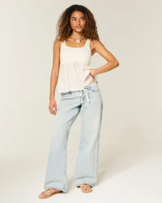 Jean baggy taille basse délavé clair avec mini ceinture et lacets