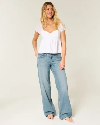 Jean baggy taille basse délavé moyen avec motif papillon Jean baggy taille basse délavé moyen avec motif papillon