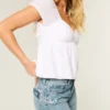 Jean baggy taille basse délavé moyen avec motif papillon Jean baggy taille basse délavé moyen avec motif papillon