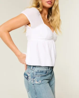 Jean baggy taille basse délavé moyen avec motif papillon Jean baggy taille basse délavé moyen avec motif papillon
