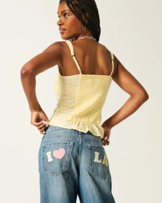 Jean baggy taille basse, délavage moyen, imprimé Los Angeles Jean baggy taille basse, délavage moyen, imprimé Los Angeles