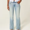 Jean bootcut taille basse, délavage moyen, brodé papillon Jean bootcut taille basse, délavage moyen, brodé papillon