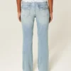Jean bootcut taille basse, délavage moyen, brodé papillon Jean bootcut taille basse, délavage moyen, brodé papillon