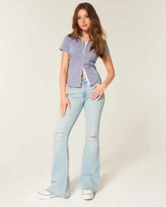 Jean flare taille haute délavé clair déchiré
