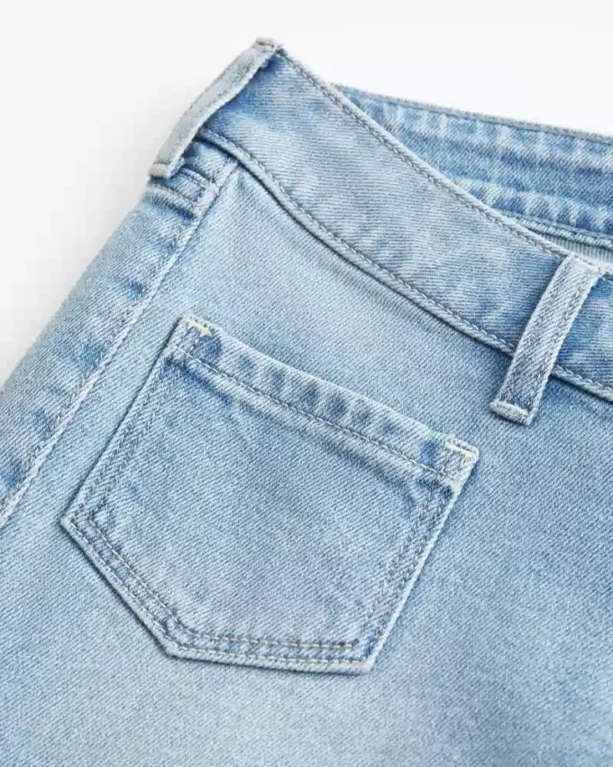 Jean flare taille ultra basse délavé clair avec poche avant Jean flare taille ultra basse délavé clair avec poche avant