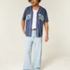 Jean super baggy délavé clair avec imprimé New York Jean super baggy délavé clair avec imprimé New York