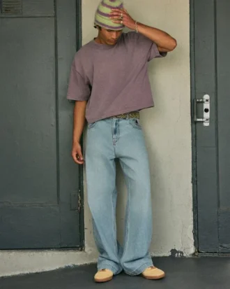 Jean super baggy délavé clair avec motif astronaute