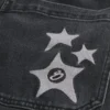 Jean super baggy noir délavé à motif étoile Jean super baggy noir délavé à motif étoile