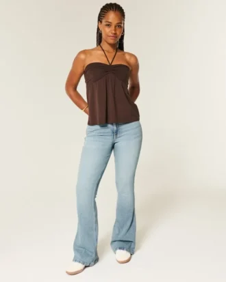 Jean évasé taille haute coupe courbes délavage moyen