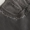 Jean évasé taille haute noir délavé brodé Jean évasé taille haute noir délavé brodé