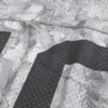 Jersey ample à motif camouflage