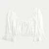 Mini-haut court à manches trois-quarts Mini-haut court à manches trois-quarts