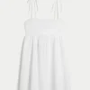 Mini-robe babydoll à bretelles nouées Mini-robe babydoll à bretelles nouées