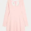 Mini-robe babydoll à nouer dans le dos Mini-robe babydoll à nouer dans le dos