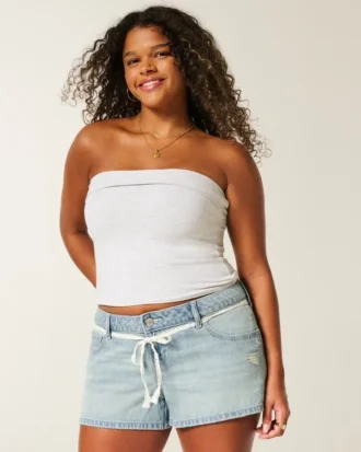 Mini-short en jean à taille ultra basse, délavage clair, avec lacets en dentelle