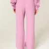 Pantalon de survêtement à jambes larges avec motif rose scintillant Pantalon de survêtement à jambes larges avec motif rose scintillant