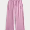 Pantalon de survêtement à jambes larges avec motif rose scintillant Pantalon de survêtement à jambes larges avec motif rose scintillant
