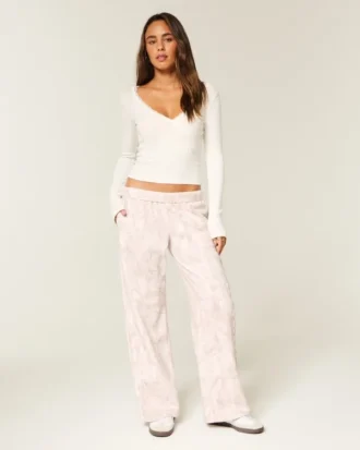 Pantalon de survêtement large à logo graphique rose camouflage
