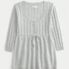 Pull babydoll en maille torsadée Pull babydoll en maille torsadée