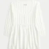 Pull babydoll en maille torsadée Pull babydoll en maille torsadée