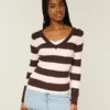 Pull iconique à col en V et torsades