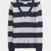 Pull iconique à col en V et torsades
