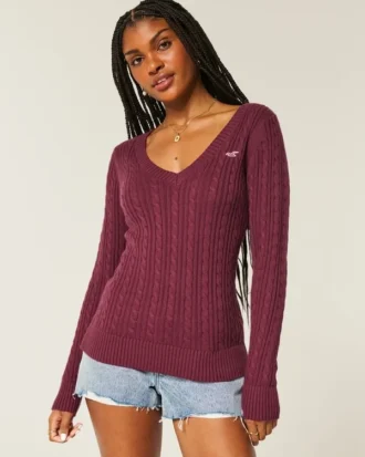 Pull iconique à col en V et torsades