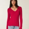 Pull iconique à col en V et torsades