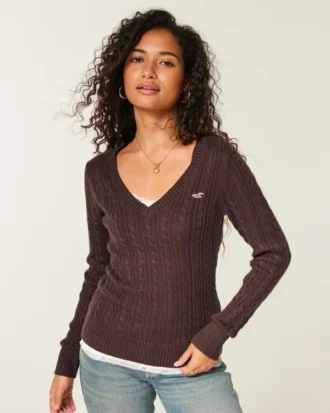 Pull iconique à col en V et torsades
