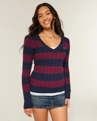 Pull iconique à col en V et torsades