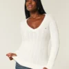 Pull iconique à col en V et torsades