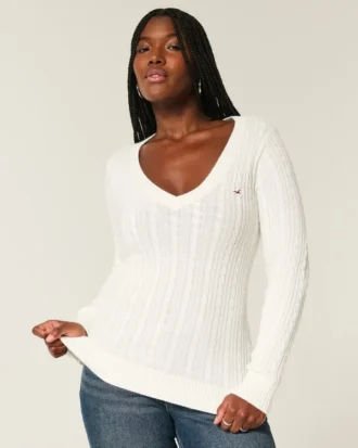 Pull iconique à col en V et torsades