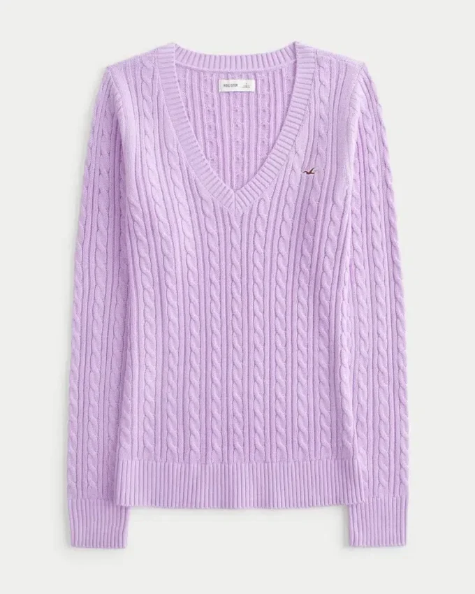 Pull iconique à col en V et torsades