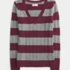 Pull iconique à col en V et torsades