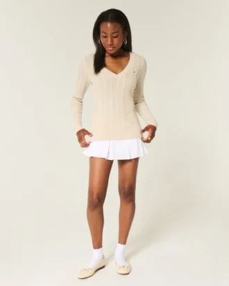 Pull iconique à col en V et torsades