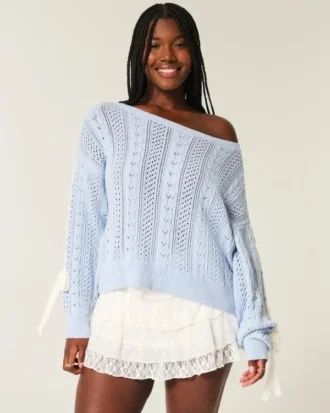 Pull à manches bouffantes et motif torsadé