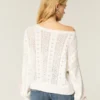 Pull à manches bouffantes et motif torsadé Pull à manches bouffantes et motif torsadé