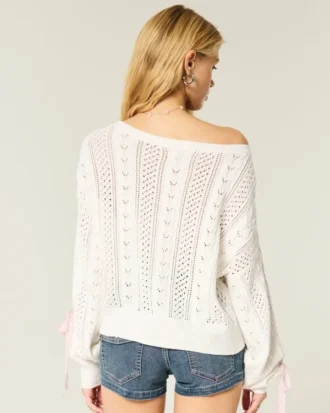 Pull à manches bouffantes et motif torsadé