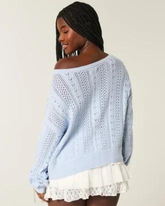 Pull à manches bouffantes et motif torsadé
