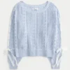 Pull à manches bouffantes et motif torsadé Pull à manches bouffantes et motif torsadé