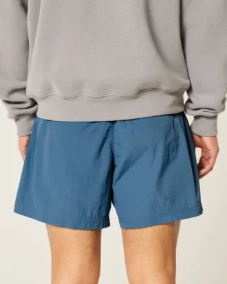 Short de football ample mi-cuisse